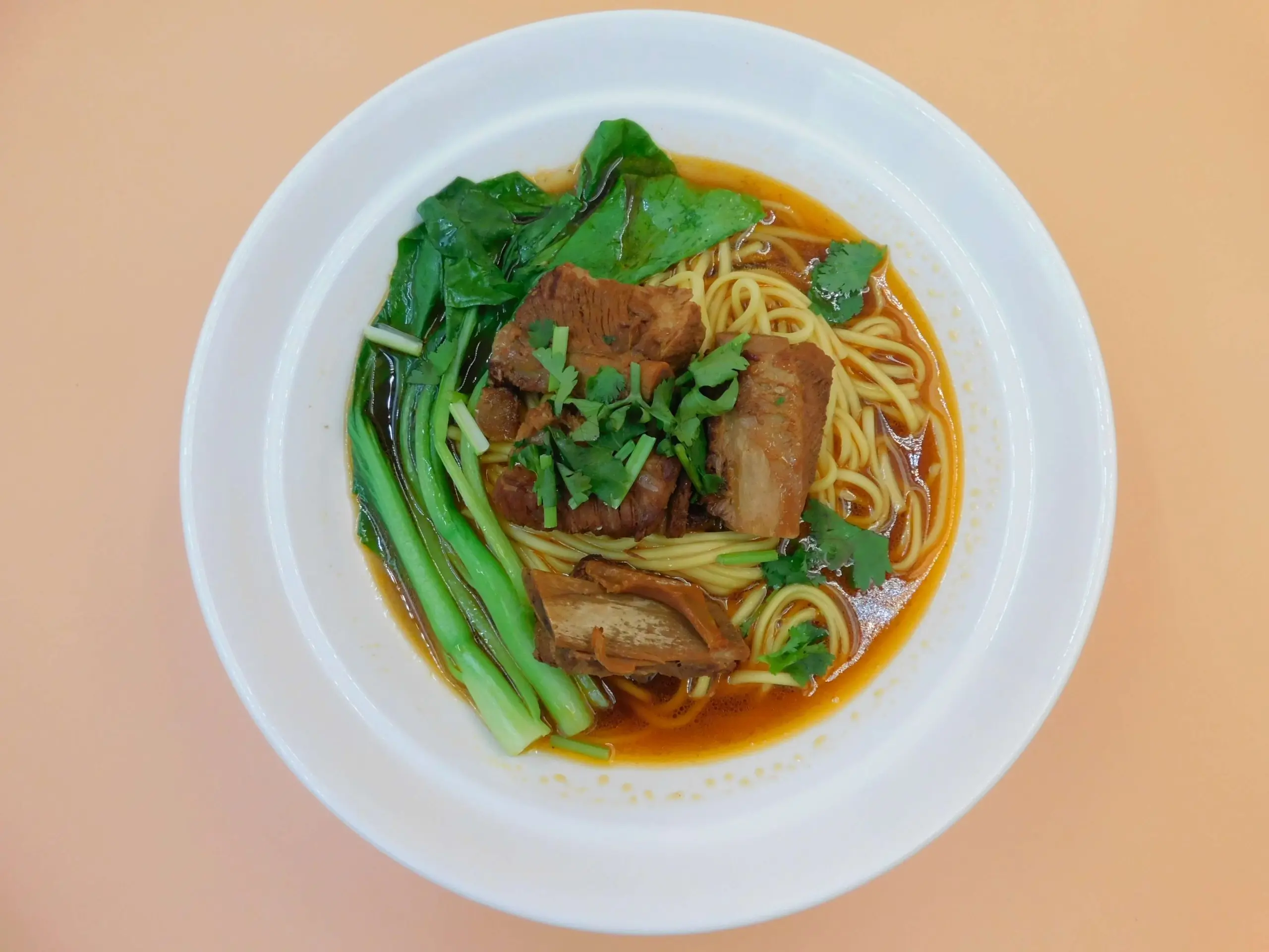 Impressive-Noodle&Okinii-Japanese-Restaurant-Asian-Fusion-Restaurant-Braised-Pork-Rib-Noodle-Soup-Massapequa Braised pork rib noodle soup with tender ribs and greens at Impressive Noodle & Okinii Japanese Restaurant, a Asian Fusion Restaurant in Massapequa