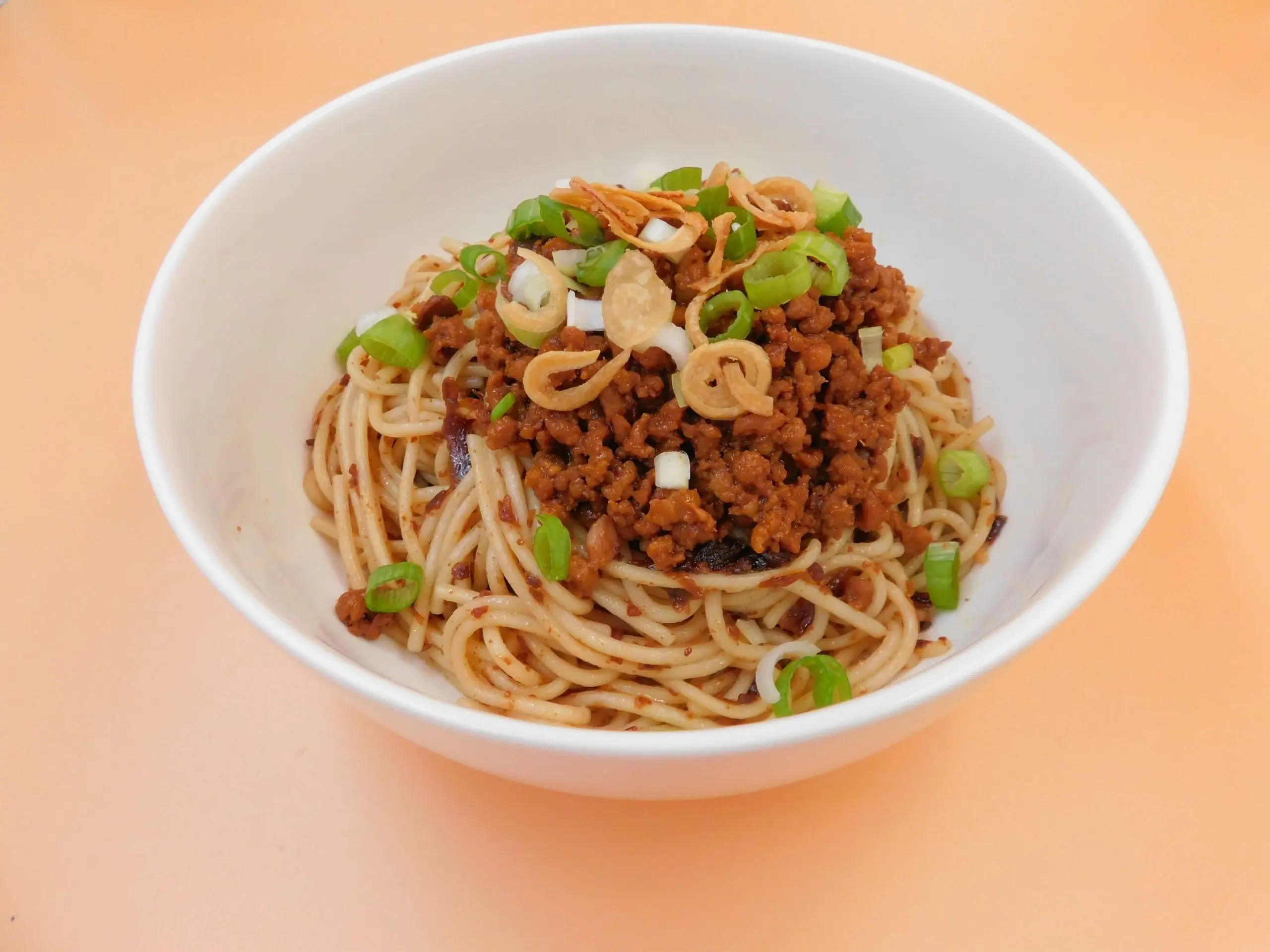 Impressive-Noodle&Okinii-Japanese-Restaurant-Asian-Fusion-Restaurant-Meat-Mince-Dry-Noodles-Massapequa Dry noodles with meat mince, green onions and crispy toppings at Impressive Noodle & Okinii Japanese Restaurant, a Asian Fusion Restaurant in Massapequa