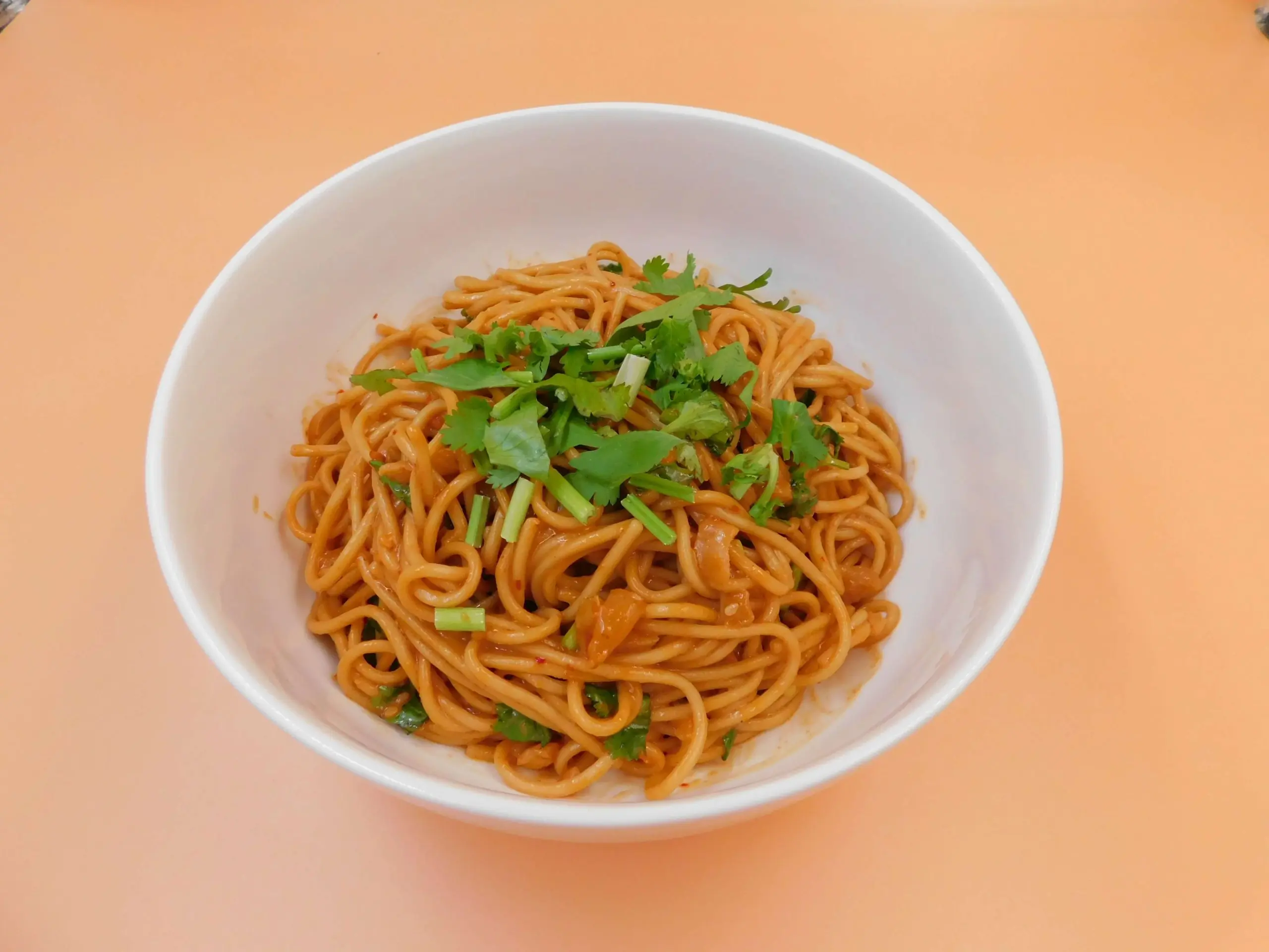 Impressive-Noodle&Okinii-Japanese-Restaurant-Asian-Fusion-Restaurant-Spicy-Cold-Noodles-Massapequa Spicy cold noodles with cilantro and green onions at Impressive Noodle & Okinii Japanese Restaurant, a Asian Fusion Restaurant in Massapequa