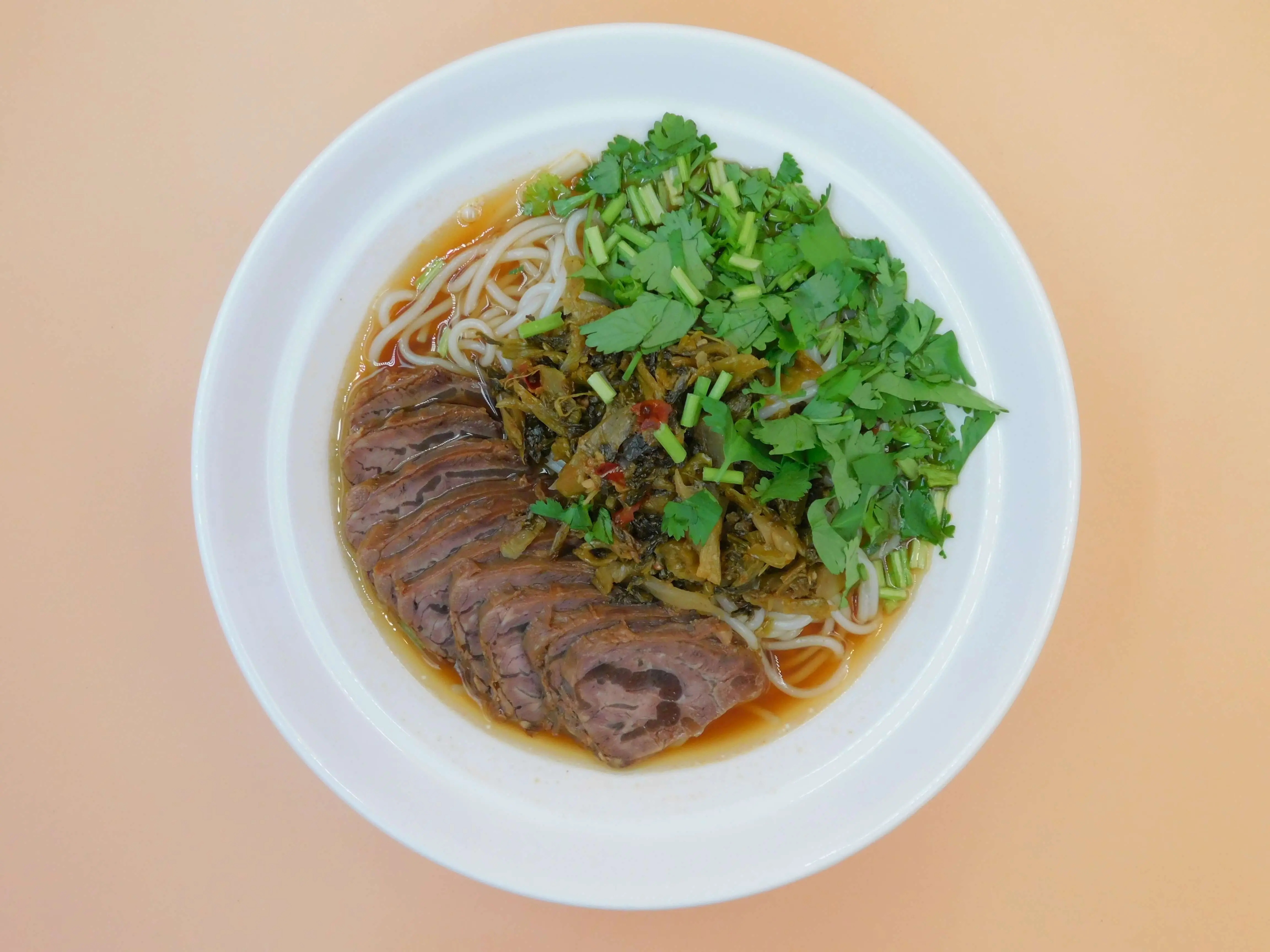 Impressive-Noodle&Okinii-Japanese-Restaurant-Asian-Fusion-Restaurant-Beef-Slice-Rice-Noodle-Soup-Massapequa Rice noodle soup with beef slices, pickled veggies and cilantro at Impressive Noodle & Okinii Japanese Restaurant, a Asian Fusion Restaurant in Massapequa